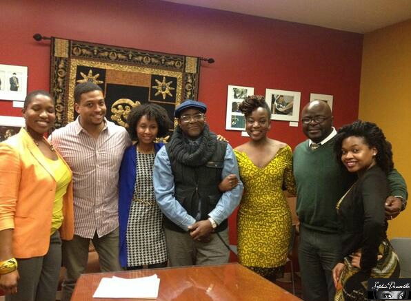 Haitian American Artist,
Sophia Domeville as event producer standing next to guest panelists and Akoma Newark Sister Circle Members.